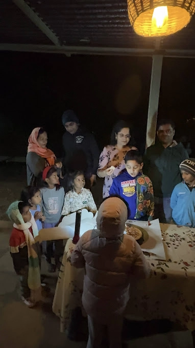 children enjoying outdoor birthday party nature camp night sky Pune